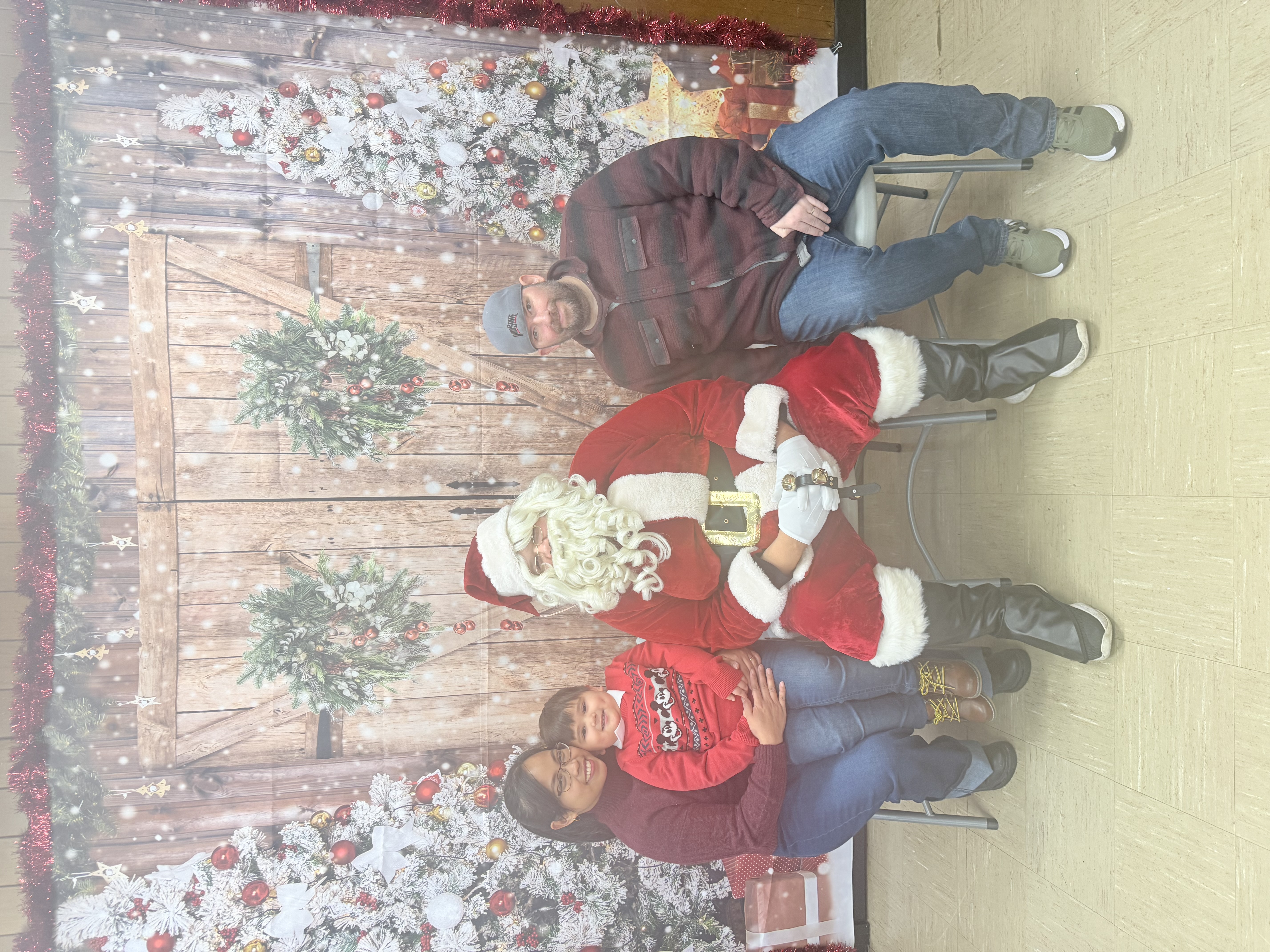Photograph of a family posing with Santa.